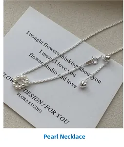 Macro detail of S925 silver necklace featuring a pearl circle and heart-shaped pendant