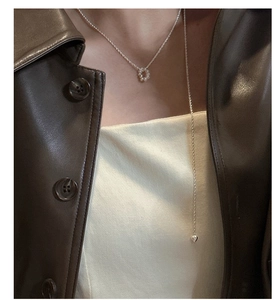 Detail of S925 sterling silver long necklace featuring baroque pearls and heart pendant