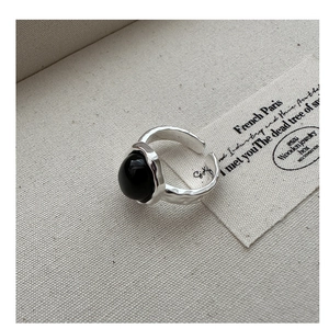 Macro view of S925 silver ring featuring irregular lava texture and large black onyx stone