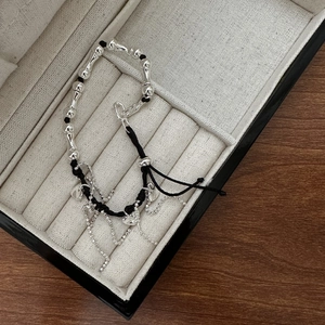 S925 sterling silver beaded bracelet featuring heart charm and tassel in jewelry box
