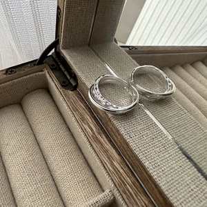 Minimalist S925 sterling silver double-layer textured open ring on a wooden jewelry box