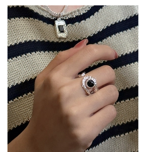 Detailed shot of S925 silver ring featuring lava texture and black onyx gemstone