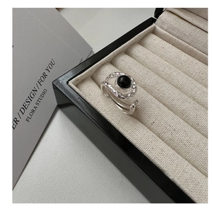 Detailed view of S925 silver ring with hammered texture and black agate stone inlay