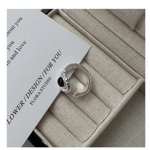 Detail of S925 sterling silver ring with black agate stone and hammered texture design