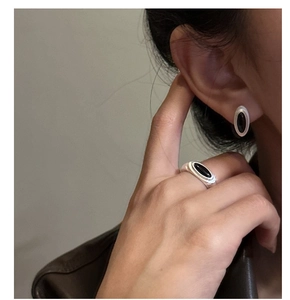 Detail showing S925 silver matte ring and earrings set with oval black agate stone