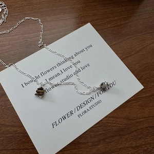 Minimalist S925 silver Saturn necklace featuring tiger eye and dalmatian stone pendants