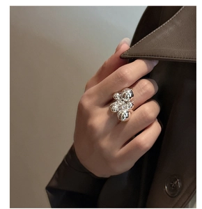 Detail of S925 sterling silver beaded ring on finger with polished sphere clusters