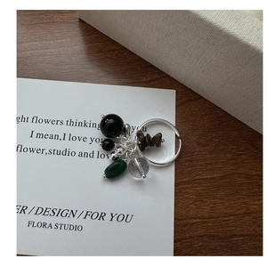 Detail of S925 silver adjustable ring with multi-color beads and natural stones