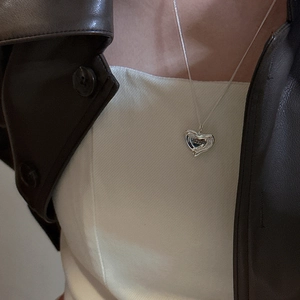 S925 sterling silver irregular heart necklace with Midsummer engraving on a model