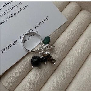 Detail of S925 silver ring with colorful bohemian beads in a velvet jewelry box