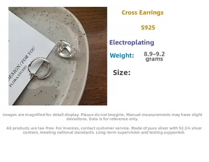 Macro view of crossover S925 silver earrings with polished electroplated finish details