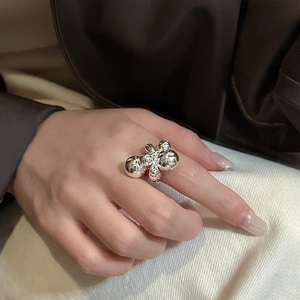 S925 sterling silver ring with stacked polished bead clusters on a model's finger