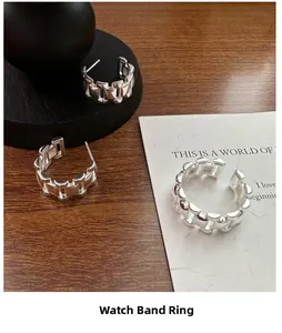 Detail of S925 silver ring and earrings set with modern watchband link design