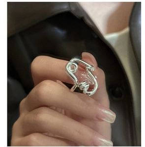 Macro shot of S925 sterling silver twisted paperclip ring with deconstructive design