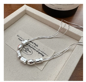 Detail shot of S925 sterling silver multi-layer necklace with hammered texture beads