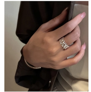 Detail of S925 silver watchband ring featuring rectangular cut zircon stones on finger