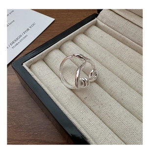 Detailed view of an S925 sterling silver twisted line ring inside a premium jewelry box