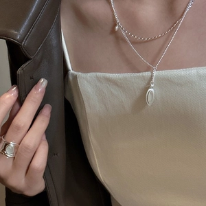 Double-layered S925 silver necklace with teardrop pendant and vintage wide metal ring
