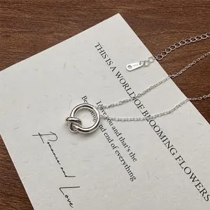 Macro shot of S925 sterling silver knot pendant necklace with hallmark on O-chain