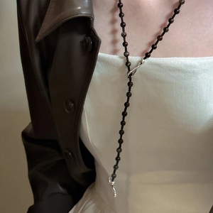 Retro S925 silver long necklace with dark brown beads and an S-hook clasp on a model