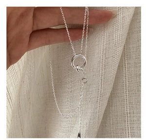 Detail showing the adjustable lobster clasp and polished S925 sterling silver knot pendant