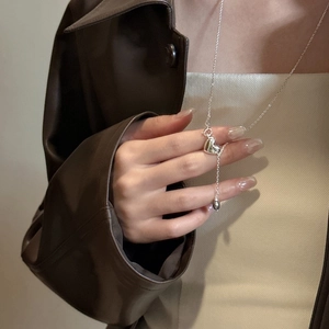 Minimalist S925 sterling silver heart pendant necklace on model with leather jacket