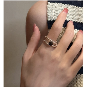 Close-up of S925 sterling silver double-layer ring with black onyx stone on finger
