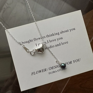 Minimalist S925 sterling silver heart necklace with dark bead pendant on display card