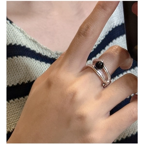Close-up of S925 sterling silver double-layered ring with a round black onyx gemstone