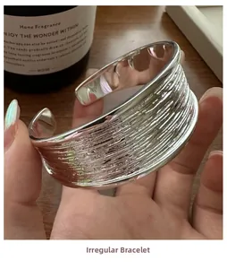 Detailed view of the handcrafted irregular texture on the silver S925 sterling silver bangle