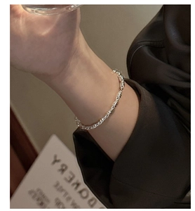 Close-up of S925 sterling silver bamboo texture link bracelet on female wrist