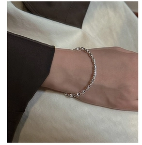 Minimalist S925 silver bracelet with cylindrical links shown on a woman wrist
