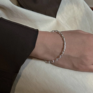 Minimalist S925 sterling silver cylinder chain bracelet worn on a woman's wrist
