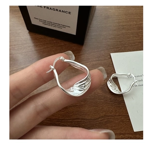 Detail showing S925 hallmark on minimalist silver textured hoop earrings for women