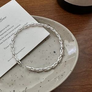 Polished S925 sterling silver cuff bracelet featuring a minimalist bamboo segment design