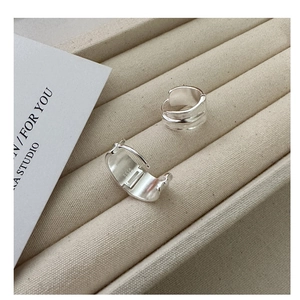 Macro shot of S925 sterling silver hoop earrings with matte finish and inner hallmark