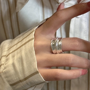 Minimalist S925 sterling silver ring with hammered texture finish on a finger