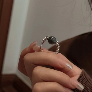 Minimalist S925 sterling silver beaded ring with dark iridescent gemstone on hand