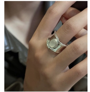 Macro shot of S925 silver ring featuring an oval moonstone and lava texture detail