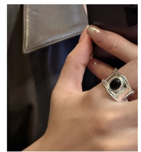 Close-up of S925 sterling silver ring with oval black onyx gemstone in vintage style