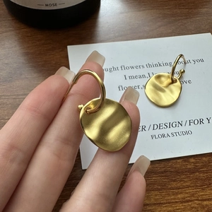 Minimalist S925 silver earrings with irregular pleated texture and matte gold finish