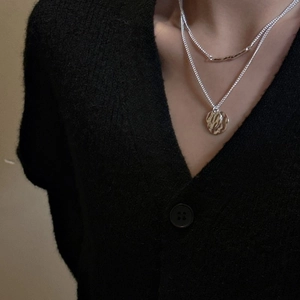 S925 sterling silver double-layer necklace with textured round pendant on model