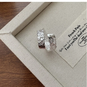 Macro view of S925 sterling silver ring featuring a unique hammered texture finish