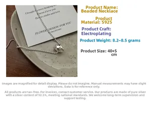 Macro shot of S925 sterling silver hammered teardrop necklace showing polished metal texture