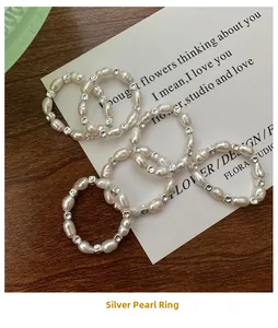 Detailed view of elastic S925 sterling silver beaded rings with freshwater pearls