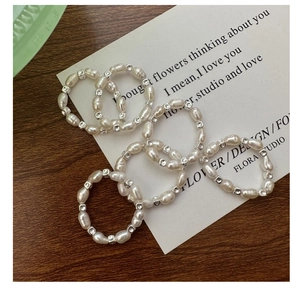 Detailed view of handmade S925 silver square beads and baroque pearl ring set on cards