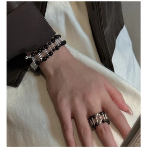 Minimalist S925 silver bracelet featuring black agate beads and geometric metal bars