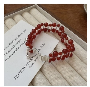 Detail of S925 silver bracelet with double-row red agate beads and metal toggle clasp