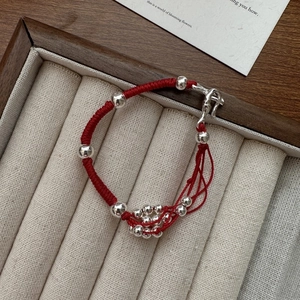 Minimalist red braided rope bracelet with polished S925 silver beads and unique metal clasp