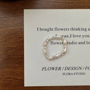 Minimalist S925 silver square bead and Baroque pearl elastic ring on a vintage card